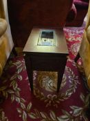 A pair of rectangular dark-stained wood end tables, featuring a recessed central glass panel on
