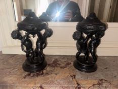 A pair of decorative lidded spelter urns, reflecting the Neoclassical Revival style of the late 19th