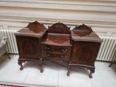 A Romweber Chippendale Style Flame Mahogany Sideboard Buffet. The tripartite wooden cabinet features
