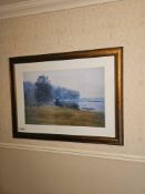 A framed landscape print attributed to Megan Lightell depicting a misty scene with dark trees