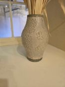 Decorative ceramic vase – embossed floral motif – A decorative ceramic vase with a bulbous body