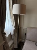 Numirra modern floor lamp featuring a tall, slender metal stand matte finish, and a large neutral-