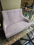 An upholstered high back contemporary sofa button back with shaped arms and seat pad 138 x 53 x