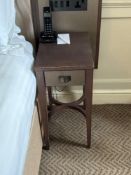 A pair of nightstands with a single drawer, The drawer features a textured, woven, front panel and a