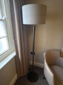 Numirra modern floor lamp featuring a tall, slender metal stand matte finish, and a large neutral-