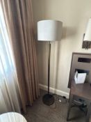 Numirra modern floor lamp featuring a tall, slender metal stand matte finish, and a large neutral-