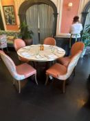 A Large circular dining table the marble effect melamine top raised on a wooden pedestal 125 x