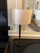 Numirra modern table lamp featuring a slender metal stand matte finish, and a neutral-toned fabric