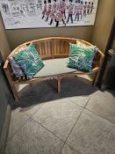 A teak banana bench 150 x 60 x 47cm (Location Public Space )