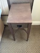 A pair of nightstands with a single drawer, The drawer features a textured, woven, front panel and a