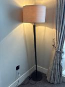 Numirra modern floor lamp featuring a tall, slender metal stand matte finish, and a large neutral-