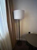Numirra modern floor lamp featuring a tall, slender metal stand matte finish, and a large neutral-