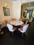 A Large circular dining table the marble effect melamine top raised on a wooden pedestal 125 x
