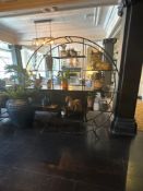 A open circular form display unit the powder coated black metal frame with tiered shelving 190 x