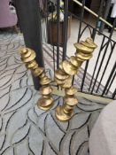 A set of 2 x cast brass sculptures each structure feature tiered base, adorned with statement