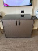 Two door cabinet embossed facia panel doors open to reveal internally fitted cubby space, drawers