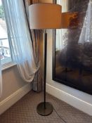 Numirra modern floor lamp featuring a tall, slender metal stand matte finish, and a large neutral-
