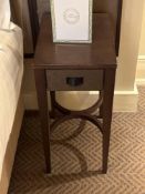 A pair of nightstands with a single drawer, The drawer features a textured, woven, front panel and a