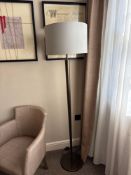 Numirra modern floor lamp featuring a tall, slender metal stand matte finish, and a large neutral-