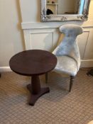 A mahogany occasional table and a contemporary upholstered chair ( Location John Clode Suite )
