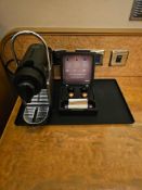 Nespresso Pod machine A compact capsule-based espresso machine in matte black with ribbed