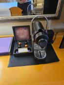 Nespresso Pod machine A compact capsule-based espresso machine in matte black with ribbed