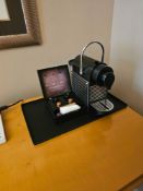 Nespresso Pod machine A compact capsule-based espresso machine in matte black with ribbed