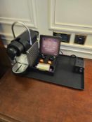 Nespresso Pod machine A compact capsule-based espresso machine in matte black with ribbed