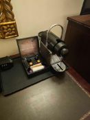 Nespresso Pod machine A compact capsule-based espresso machine in matte black with ribbed