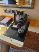 Nespresso Pod machine A compact capsule-based espresso machine in matte black with ribbed