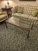 A rectangular Hollywood regency style coffee table finished in bronzed metal the tempered glass