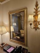 A bevelled mirror measuring approx. 80 x 120cm, presented in a decorative frame with classical