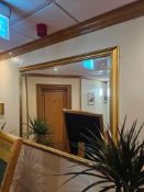 A large bevelled accent mirror in gold painted profile frame 130 x 103cm [Loc Conference]