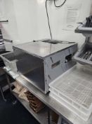 Catersave compact cutlery polisher with front-loading design and integrated UV sanitising lamp.