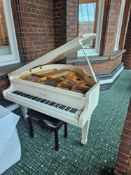 Offenbach baby grand piano, serial G030207. Approx. 140 cm long × 143 cm wide × 98 cm high. White