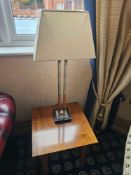Pair of contemporary table lamps featuring sleek nickel-finished metal frames with rectangular