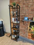 Asymmetrical bookcase or display étagère featuring a sculptural open-shelf design with staggered