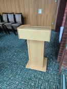 Freestanding lectern, approx. 70 × 60 × 120 cm. Sloped reading surface with raised lip, finished