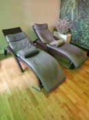 Pair of Siesta Fiji spa loungers with curved ergonomic frames and grey upholstered cushions.