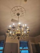 Flemish-style chandelier in polished brass, featuring a two-tier arrangement of 18 scroll arms, each