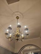 Flemish-style chandelier in polished brass, featuring arrangement of 8 scroll arms, each terminating