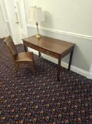 A mahogany writing table two drawer raised on square legs complete with side chair 120 x 60 x