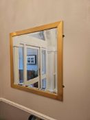 Square giltwood wall mirror, approx. 97 × 98 cm. The frame features a clean, classical profile