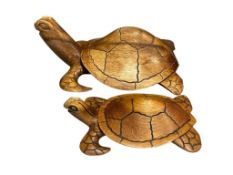TWO CARVED WOODEN SEA TURTLES BY JAMAICAN ARTIST DANNY DREAD