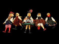 FIVE VINTAGE AUSTRIAN HANDMADE WOODEN DOLLS WITH PAINTED FACIAL FEATURES