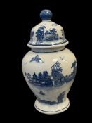 DECORATIVE BLUE AND WHITE PORCELAIN JAR WITH ASIAN VILLAGE SCENRY AROUND BODY AND LID