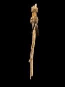 NATIVE AMERICAN CRAFTED DRIFTWOOD WALKING STICK DECORATED WITH LEATHER AND ANIMAL FUR