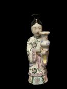 VINTAGE CHINESE IMPORT PORCELAIN FIGURE OF A WOMAN HOLDING VASE MARKED ON BOTTOM
