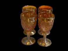 1940'S MARIGOLD CARNIVAL GLASS CORDIALS GRAPEVINE PATTERN WITH RIBBED STEMS, SET OF FOUR
