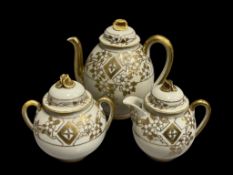 GILT AND ENAMELED DECORATED PORCELAIN TEAPOT WITH MATCHING CEAMER AND SUGAR BOWL